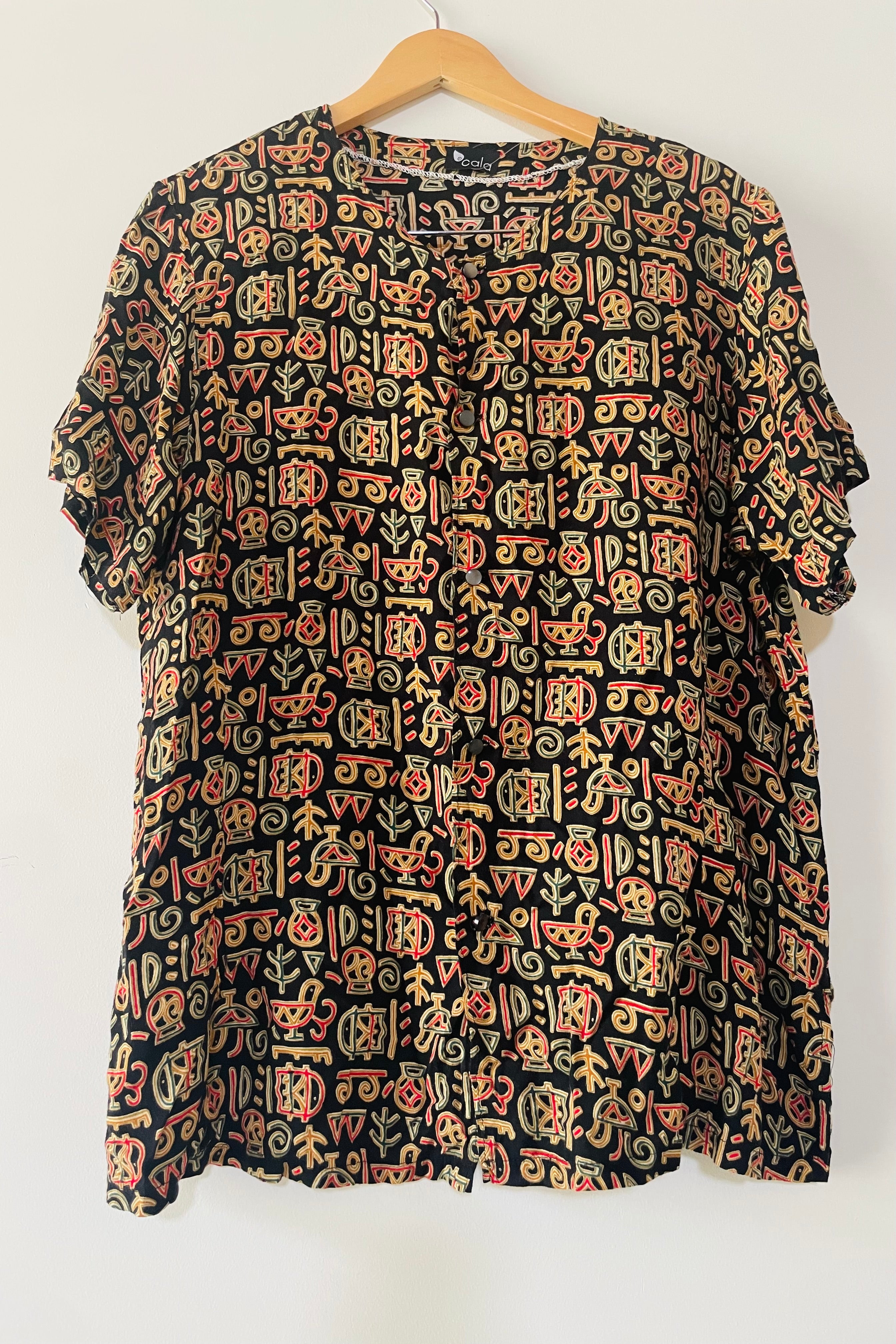 חולצת וינטג׳ כתב סתרים