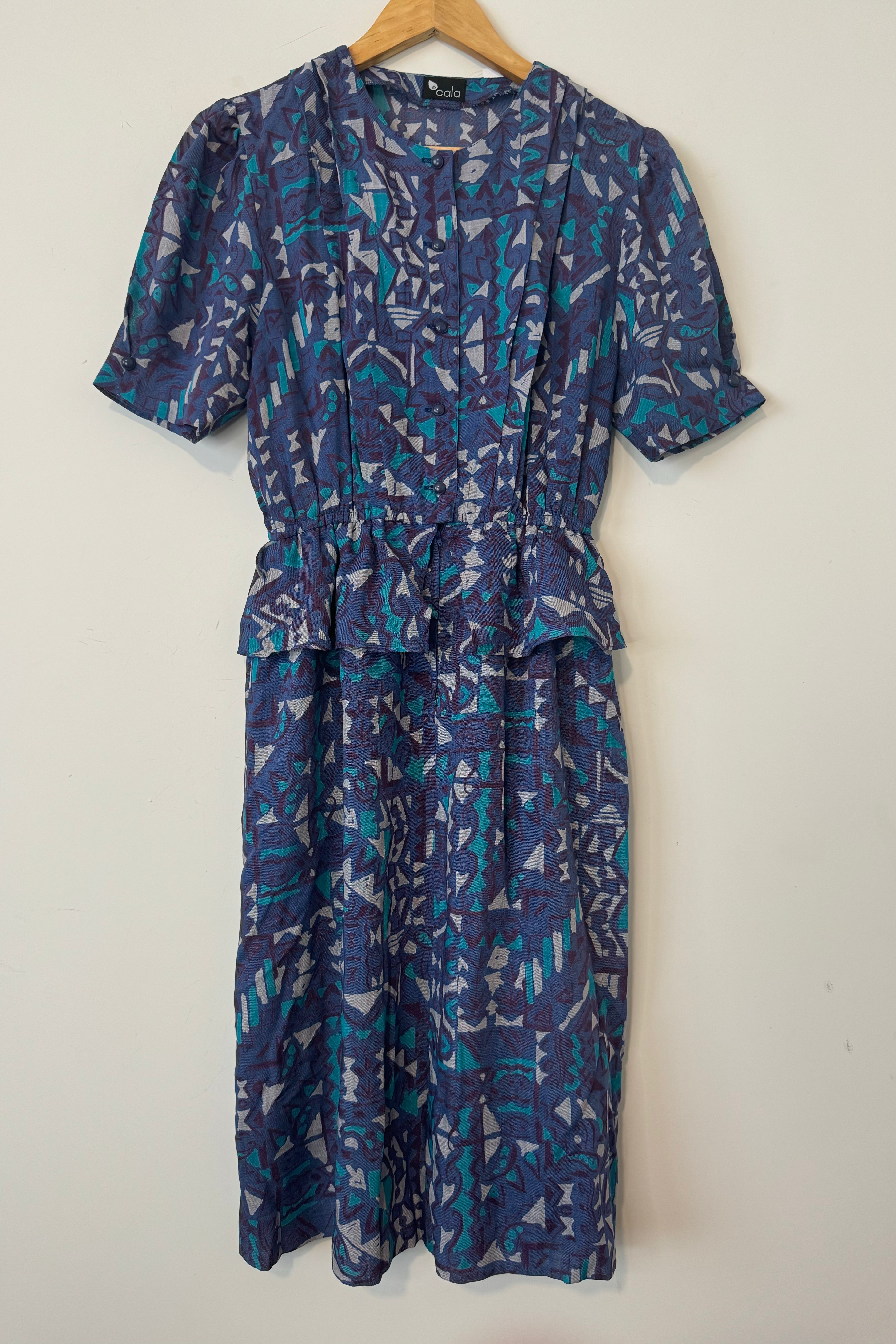 שמלת וינטג׳ הדפס מיקס של צורות בד כותנתי נושם.